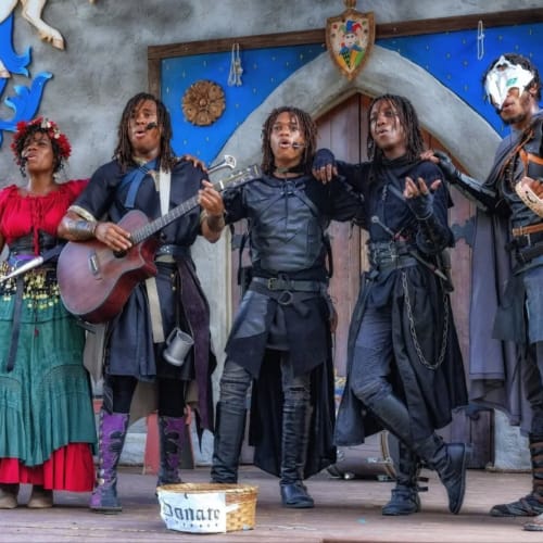 Fortress Dwellers group singing on stage